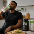 Coach Foster drinking a Herbalife Formula 1 shake in Zambia as part of a healthy active lifestyle.